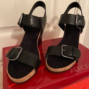 Aerosols strappy black wedges.